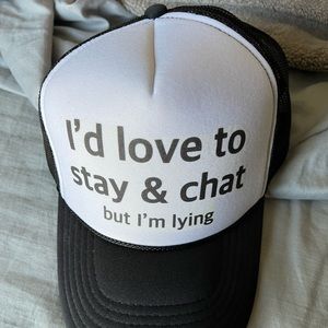 Black and white trucker hat w/adjustable snap back.